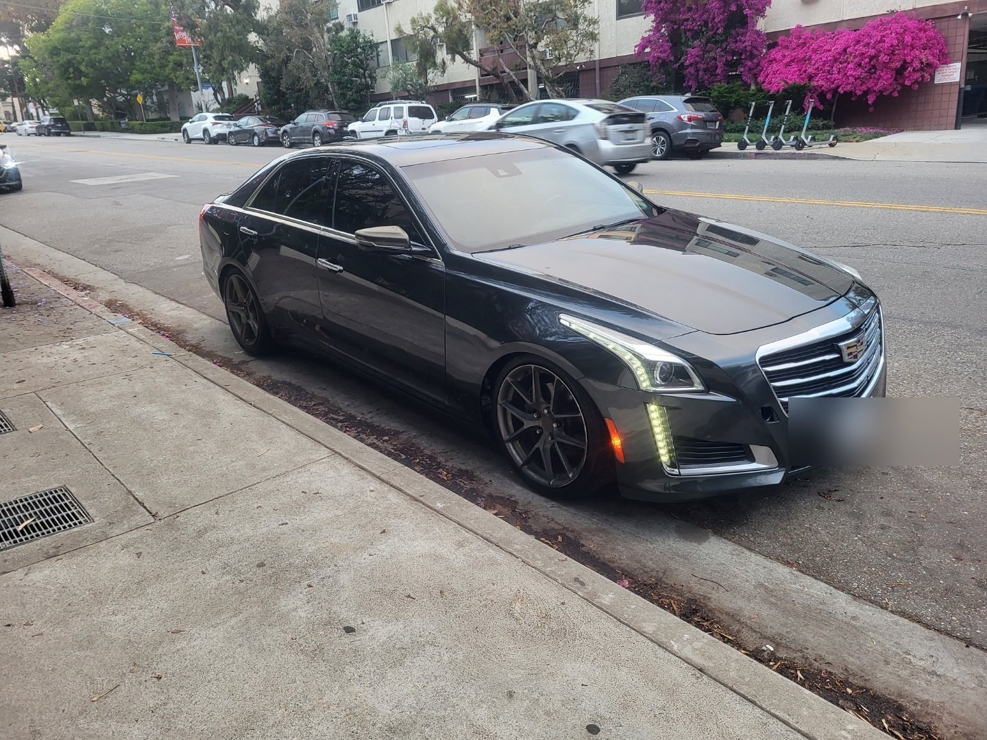 Repaired Cadillac CTS, front-left corner collision rebuild